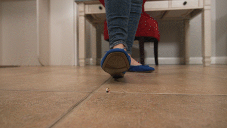 Jolene Hexx is a teacher who is supervising detention. She walks in and recognizes one of her students - it is her most disruptive and yet her tiniest student she has ever taught. She walks up to him, she stomps as she tells him about how disruptive that he has been in her class - disrupting other students and her. She has something special in mind for him. She picks him up, she sits down and places him at her feet. He is going to be her little personal foot slave during this detention in hopes of curbing his behavior. We watch as she dips and dangles her shoes, placing her bare feet right in front of him, making him worship and lick her giant feet as she grades papers. At the end she puts him in her shoes while she goes to make copies for an upcoming exam.