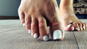 <h4>The Missing Boyfriend</h4>

Loryelle and her boyfriend Brandon have arranged to meet in Loryelle’s flat.
When Loryelle comes home from swimming, her boyfriend doesn’t seem to be there and cannot be reached by phone. So she calls her best friend Tara, to find out, if she knows where Brandon is. They joke about shrinking Brandon for his unreliability and squish him like a bug. Tara knows about Loryelle’s secret ability to shrink people, so it’s probably not a joke at all.<br><br>
<h4>The 1/5 inch Bugmen</h4>

Brandon and some of his friends were waiting at Loryelle’s flat for her to return. They have planned a surprise party, but they got shrunken down to 1/5 inch somehow before Loryelle arrives at home. Probably Brandon has read the forbidden lines in Loryelle’s secret diary… But we don’t know. ;-)
<br><br>
The clip starts when Loryelle walks around in her flat, wearing her bikini and her flip flops and calls her friend Tara, while the flea sized people at her feet run for their tiny lifes.<br><br>
<h4>SLAM!</h4>

Loryelle’s mountain sized flip flop hits the ground and almost squishes one of the shrunken guys and a nearby car. The bugman thinks he had luck, but before he realizes what’s going on, Loryelle comes back and bury him under her giant flip-flop. The tiny car gets flattened just a few moments later.
<br><br>
When you are flea sized, you don’t have that many options. Would you choose  to run away or do you try to climb the mountain sized flip flops get the giantess’ attention? Loryelle walks around in her flat while the shrunken micro people decide, how they spend their last moments, because no one can outrun a foot that is so huge you’d need several hours to walk around.
<br><br>
After a while Loryelle gets rid of her flip flops and walks around barefoot, unaware of the massacre she causes with her beautiful giant feet. Even with her sensitive soles and toes she can’t feel how the desparate bugmen get squashed beneath them.
<br><br>
When Loryelle sits down, some tiny bugmen think they have a chance to get her attention. The bravest of them tries to climb her panty along her sensitive crotch, while others still try to hit or massage her feet. But the attention they get, is not of the kind they were looking for.
<br><br>
At the end there is only Loryelle’s shrunken boyfriend Brandon left. Will she notice and rescue him? Unfortunately not. Loryelle sees nothing more than a tiny  bug. She puts her flip flops back on and squishes the 1/5 inch guy out of existence.
<br><br><h4>Heaven for Giantess Foot and Flip-Flop Lovers</h4>

You definitely want to watch this clip, if you’re interested in beautiful and very detailed macro close-ups of Loryelle’s beautiful feet, soles and toes and the very small macro people in comparision, who get squished unaware by them.
<br><br>
The clip contains a lot of barefoot and flip flop shots, a pov butt crush and a tiny man climbing Loryelle’s panty along her crotch.
<br><br>
Don’t miss this celebration for unaware feet, flip flop and giantess fans!