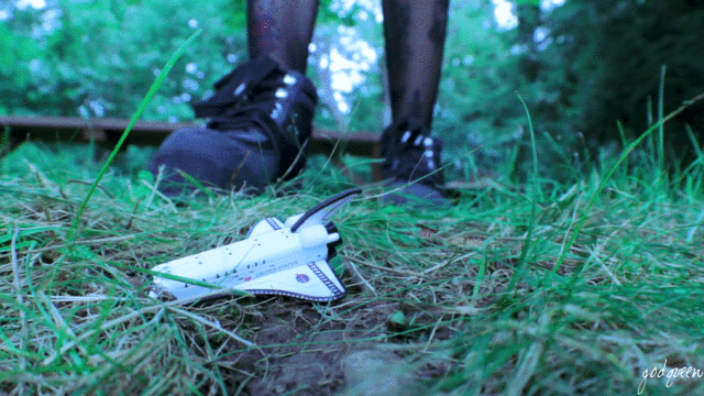 On a mission towards discovering new frontiers, a group of space travelers have crash landed onto a distant planet. Desperate for help, they make their way towards any sign of civilization. Unlucky for them, this planet's dangers are on a scale much larger than their own. An unsuspecting Lauren Ashlyn wreaks havoc on the tiny explorers, not even noticing most of them. However, when she does notice them, she mistakes them for bugs, crushing them out of their earthly existence. Grossed out by this newfound infestation, Lauren makes her way outside to smoke, when she hears the strangest noise. Following it through, Lauren comes across a tiny spaceship at her feet. After picking it up and inspecting it for a second, she notices a strange glow down by the water. Putting the spaceship down, Lauren bends over to inspect the tiny beings, when she is barraged by gunfire. Initially scared, she backs away until realizing that their bullets are having no effect on her. As the tiny invaders continue shooting, she has had enough of them, and smashes them with her hand. Intrigued by the strange glow, she reaches down...

The video flashes forward into an unknown present, where we find Lauren collecting tiny beings and boxing them up into prepackaged gifts, but for what purpose?

Video contains: Booms/Shakes, Screams, Unaware, Aware, POV, Shoe Crush, Hand Crush, Butt Crush, Entrapment, No Dialogue