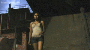 In the early evening Tenshi comes across a shrunken jet and a tank under an overpass. As cars rush by overhead, she crushes the tiny military vehicles under her sandals until there are just shards left. Tenshi kicks everything together in a small pile and softly steps on what's left then walks away, figuring they're more than done.
