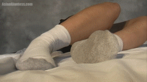 Mei Ming is resting and you wander up her body to her face when she wakes up. She doesn't seem upset to see you and thinks you're quite cute. After a few questions she pets you a bit and invites you to take a brief peek into her mouth when she finds out that you're just exploring. She's pretty shy and quiet as usual, and offers to take you home in the end, covering her hands over you.
