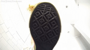 2 Simple clip of velvets stomping you from floor view with her bare feet and sneakers.
