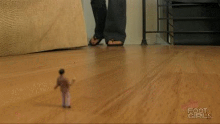 Whitney Morgan enters the room wearing her dirty summer flip flops and unawarely steps on a little man shrunken on the floor. She notices him and starts to play with him by putting him into between her flip flop and sole. She squishes him over and over with her foot as the poor man is put between hell. 
