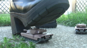 After stumbling across some tanks in her backyard, Opal puts her boots to good use by making them crunch under her weight. A mix of POV's and ground level views. This video focuses more on crushing with pressure instead of stomping.
