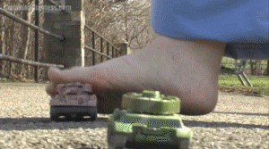 Two armies have been fighting in Kat's town, and shes tired of it. Finding a group of tanks while out at the park, she decides to crush them under her bare feet. Kat takes her time, stepping on them lightly at first, but in the end, she crushes them down.
