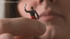 Witchy works at a retail store and she's finally had it with her customers. She's shrunken one down and taken her home to take out her frusterations on. After holding her between her fingers and telling her off for awhile, Witchy starts licking the micro sized customer. Lots of close up views of Witchy's tongue as she's tasting the tiny woman, who's eventually pulled into her huge mouth. After being played with between her lips and teeth, Witchy finally gulps her down and is surprised to find the girl still struggling in her tummy. She lays there rubbing her tummy a bit in the end.
