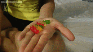 Eve has already shrunken down some of her old classmates who treated her badly and turned them into tasty snacks. One by one they're playing with and chewed up in her mouth. Lots of good views as they're tossed around inside and finally the last two are brought in together and chewed to pieces. In the end Eve very briefly rubs her tummy.
