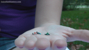 With her neighbours already shrunken down in the palm of her hand, Nikki explains that she is fed up of their wild BBQ parties. Her voice echoes high above them as she picks them out one at a time. She tries to put the first between her toes but he falls through and ends up squished under her foot in her sandal. Most end up squeezed between her toes before they fall down and get smushed. As usual there's lots of dialogue from Nikki as she torments her shrunken captives. Most of the focus throughout the video is on Nikki's toes and they all end up squished in the end.
