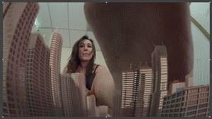 Sinn Sage brings the city to her instead of going out and finding them. She finds a gun that transports tiny cities to her, and for the second part she not only is fully aware of what she doing she gets drunk with power and revels in it crushing cities in every way possible and even eating one,  finally she dresses for the role.  Now there is a new goddess in town.
