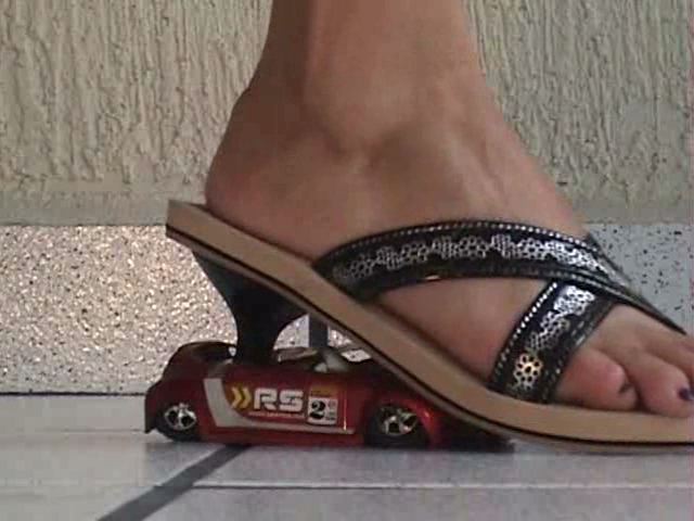 This racecar gets crushed by casual walking of a giantess. 
