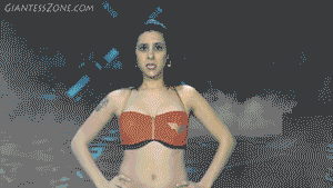 Wonder Jamie is about to defeat the terrible Dr. G-Man but he sends his drone to shoot Wonder Jamie with a growth ray that not only makes her body bigger but also releases the evil inside her and she proceeds to terrorize a small town and after eating and stomping on some people she decides to crush all the houses. She crushes more then 60 houses that were specialy made to be crushed like never before. Lots of amazing shots both POV and FX shots. We included requested booty and boob crush shots as well some more vore and handheld shots. lots of hot Giantess scenes.
